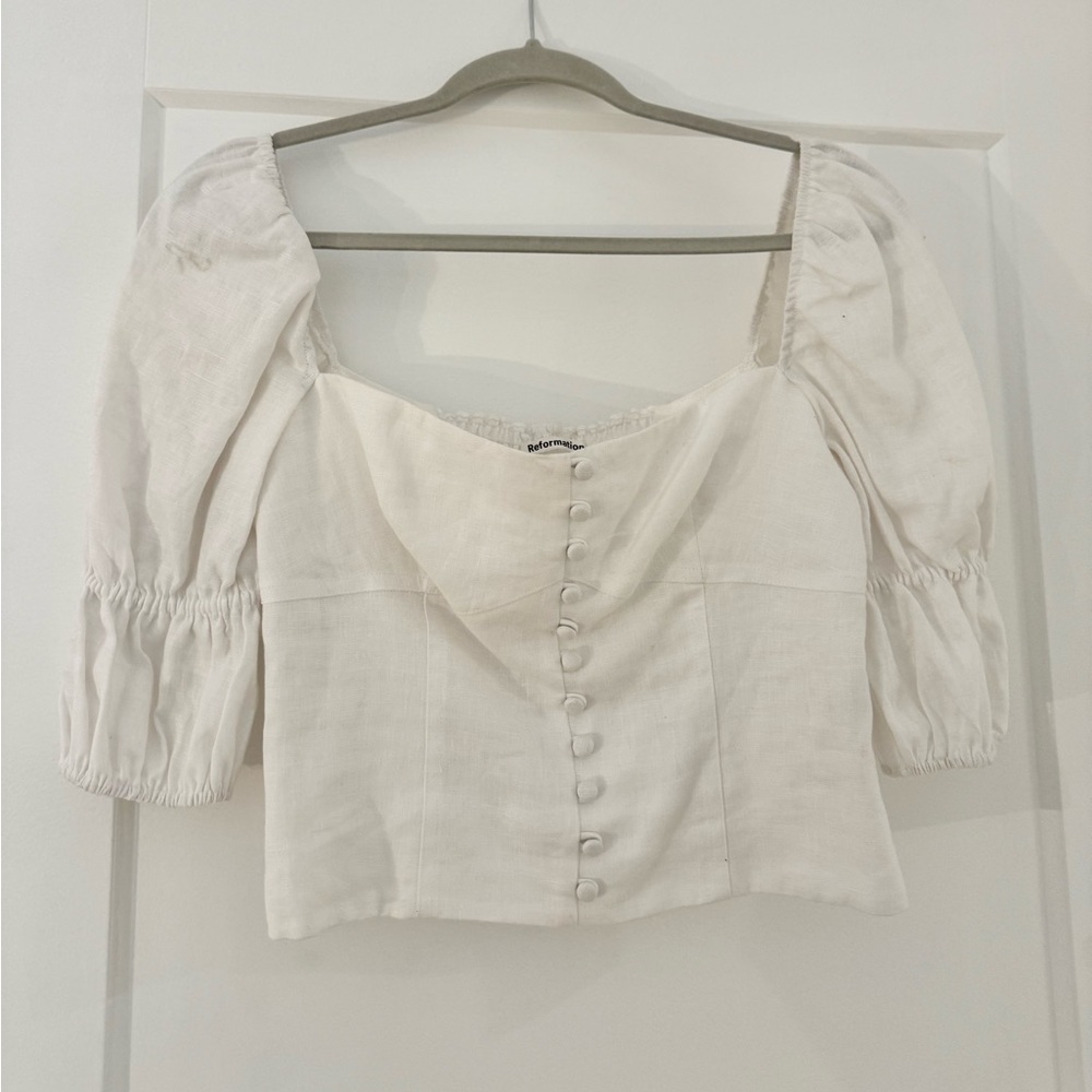 Reformation White blouse with buttons on the front.